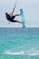 Kite surfer flying over the sea in Tarifa Spain