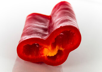 Cut of red bell pepper on white background