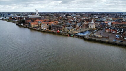 aerial view of old and new buildings over a waterway area in an urban setting