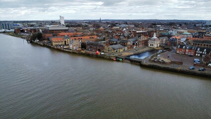 Obraz premium aerial view of old and new buildings over a waterway area in an urban setting