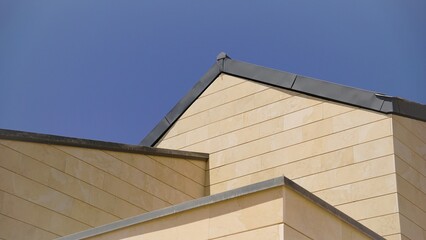 geometric facade against blue sky
