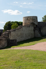 Izborsk, Russia, September 7, 2023. A fragment of a dilapidated fortress wall with a tower.