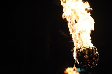 Flames of a coppara torch that lighting in Kandy Esala Perahera at Temple of the Tooth (Sri Dalada Maligawa), Kandy, Sri Lanka. - obrazy, fototapety, plakaty