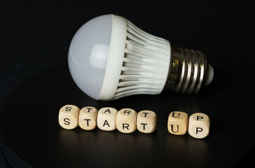 Startup Concept With Light Bulb and Letter Blocks