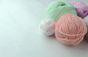 Fototapeta na wymiar Colorful yarn balls on light background 