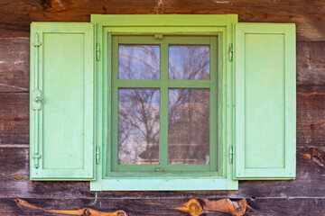Green Window at Old Wooden Cabin House