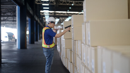 Warehouse workers use tablets to inspect products.