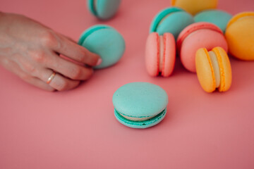 The image shows a hand holding a colorful object indoors 6203.