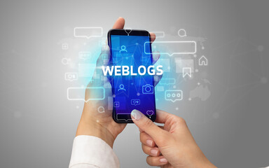 Hand using smartphone with social media concept