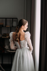 Fototapeta premium The image features a woman wearing a white dress 6475.