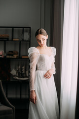 Fototapeta premium The image shows a person wearing a white dress 6476.