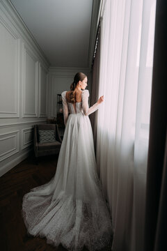 The image shows a person wearing a wedding dress indoors 6474.