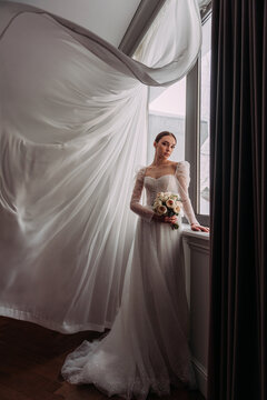 The image features a person in a wedding dress standing indoors 6499.