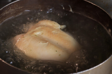 Photo of chicken boiled in a pot. Food preparation concept