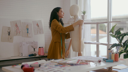Dressmaker working in fashion design studio
