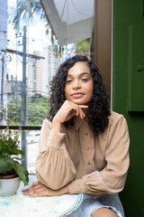 Portrait of a brazilian woman indoors at home