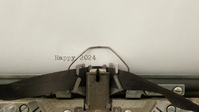 typing HAPPY 2024 on a vintage typewriter close-up