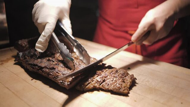 the cook cuts the meat, slice meat, baked pork,Process of cutting the steak