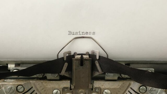 typing Business on a vintage typewriter close-up