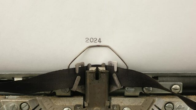 typing numbers 2024 on a vintage typewriter close-up
