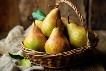 A basket of ripe pears on a rustic wooden table and a piece of cloth