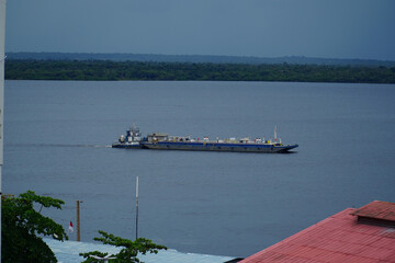 Push boat with a pontoon ship full of oil, an ecological risk posed by cargo ships in the sensitive...