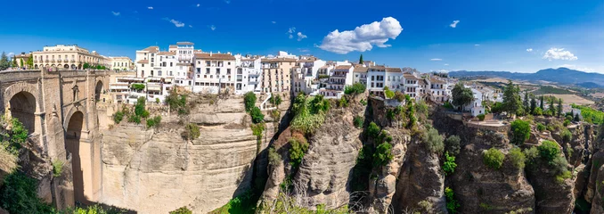 Fototapete Ronda Puente Nuevo New bridge (Puente Nuevo) and the famous white houses on the cliffs in the city Ronda, Andalusia, Spain.
