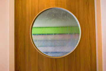 Corrugated glass texture with reflected on wooden door,modern home decor,stylish home...