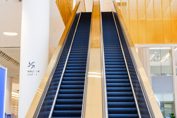 Modern luxury Escalators in an office building or shopping mall, escalator in the subway or airport.