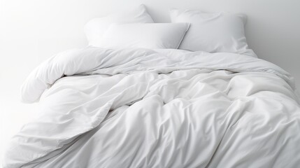 White Folded Duvet Lying on White Bed Background

