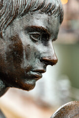 Fototapeta premium Bronze sculpture of Three Girls and a Boy on the bank of Spree River, Berlin, Germany