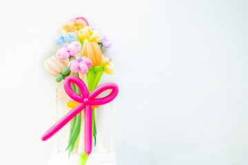 Balloons twisted into a blossoming flower bouquet on white background,Flowers Balloon to decorate the place,bouquet with colorful balloon flowers.