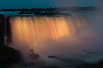 Niagara falls, Canada - June 27 2018: Colorful light shedding on the Niagara Falls
