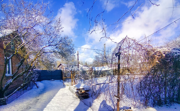 Winter landscape in the Ukrainian village with sun snd sky. Korop.