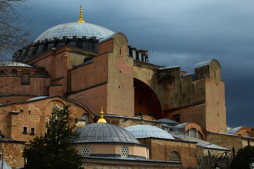 A mosque in Istanbul, the sky with its minarets and domes. Gloomy day