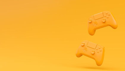 Video game joysticks or gamepads in plain monochrome yellow color background