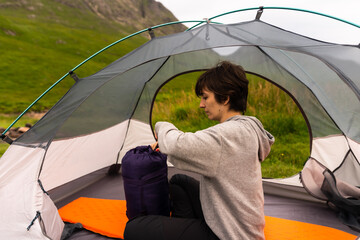 Grasslands Reverie: Tent Reading, as Sunlight Paints the Landscape with Golden Hues