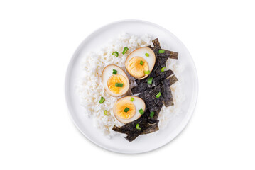 Tamago soy sauce eggs with rice and nori on a white isolated background