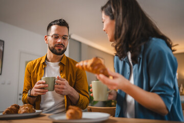 Adult couple have breakfast and cup of coffee at home morning routine