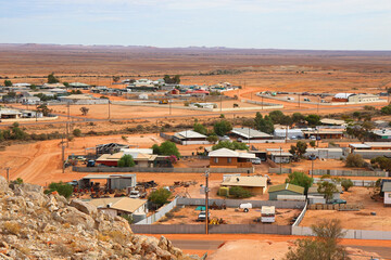 Aerial view of the Coober Pedy skyline in the outback of South Australia - Opal mining town in the red center desert where many houses are underground