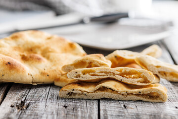 Freshly Baked Naan Bread on wooden table