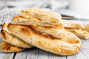 Freshly Baked Naan Bread on wooden table