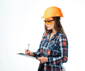 Fototapeta premium Young female photographer or video operator with digital camera and helmet on white background