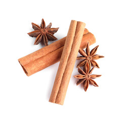 Cinnamon sticks and anise stars isolated on white, above view