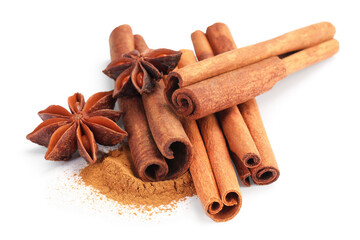 Dry aromatic cinnamon sticks, powder and anise stars isolated on white