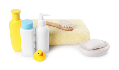 Baby cosmetic products, bath duck, brush and towel isolated on white