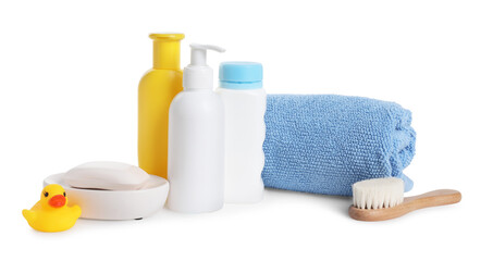 Baby cosmetic products, bath duck, brush and towel isolated on white