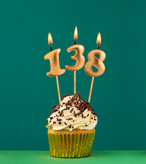 Birthday candle number 138 - Vertical anniversary card with green background