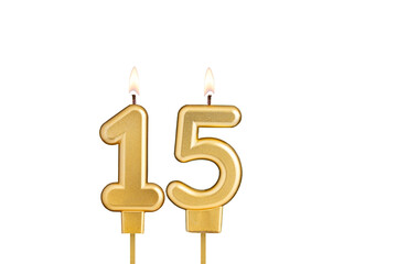 Birthday candle number 15 on white background