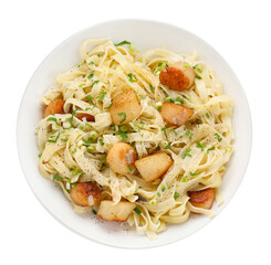 Delicious scallop pasta with spices in bowl isolated on white, top view